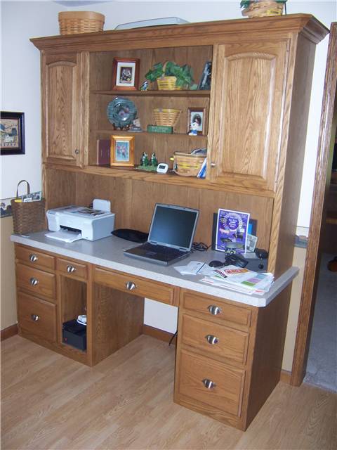 Oak computer desk with file drawers,keyboard tray, and upper display/storage cabinet